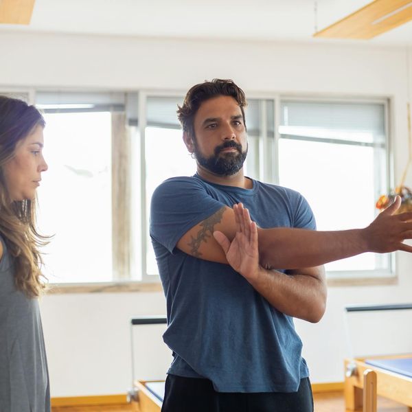 Man stretching his arms after a successful workout session